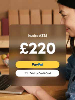 Woman working on laptop with invoice overlay showing £220 due and options to pay with PayPal, or credit or debit card